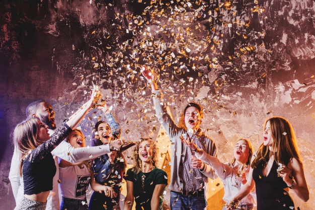 friends-having-fun-falling-confetti_23-2147651884